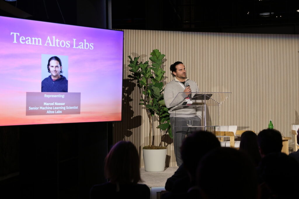 Marcel Nassar giving remarks on behalf of Team Altos at the Virtual Cell Challenge winners announcement event. [Arc Institute]